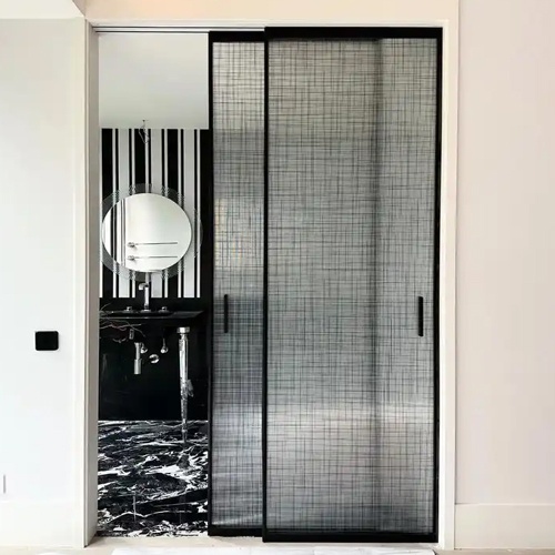 Bypass sliding door with fabric laminated glass panel
